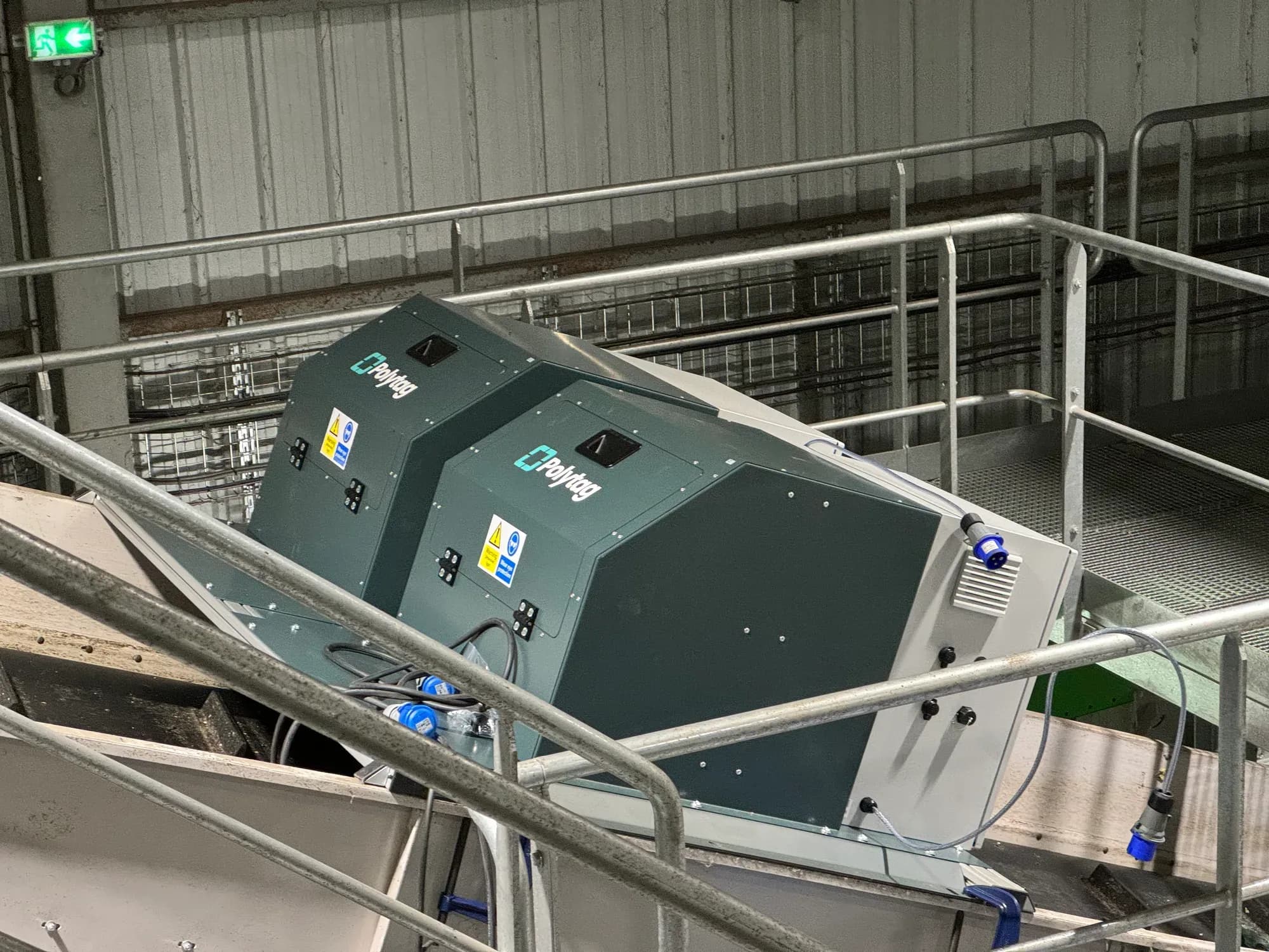 Two Polytag detection units mounted over a conveyor at a recycling centre