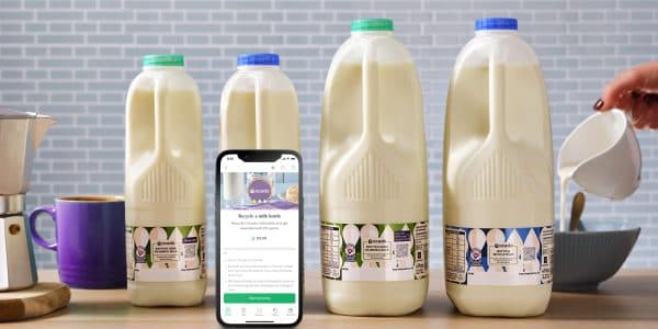 Photo of a smartphone in front of milk packaging