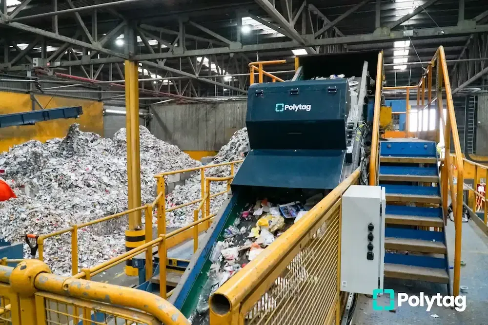 A Polytag detection unit mounted over the conveyor at a materials recovery facility