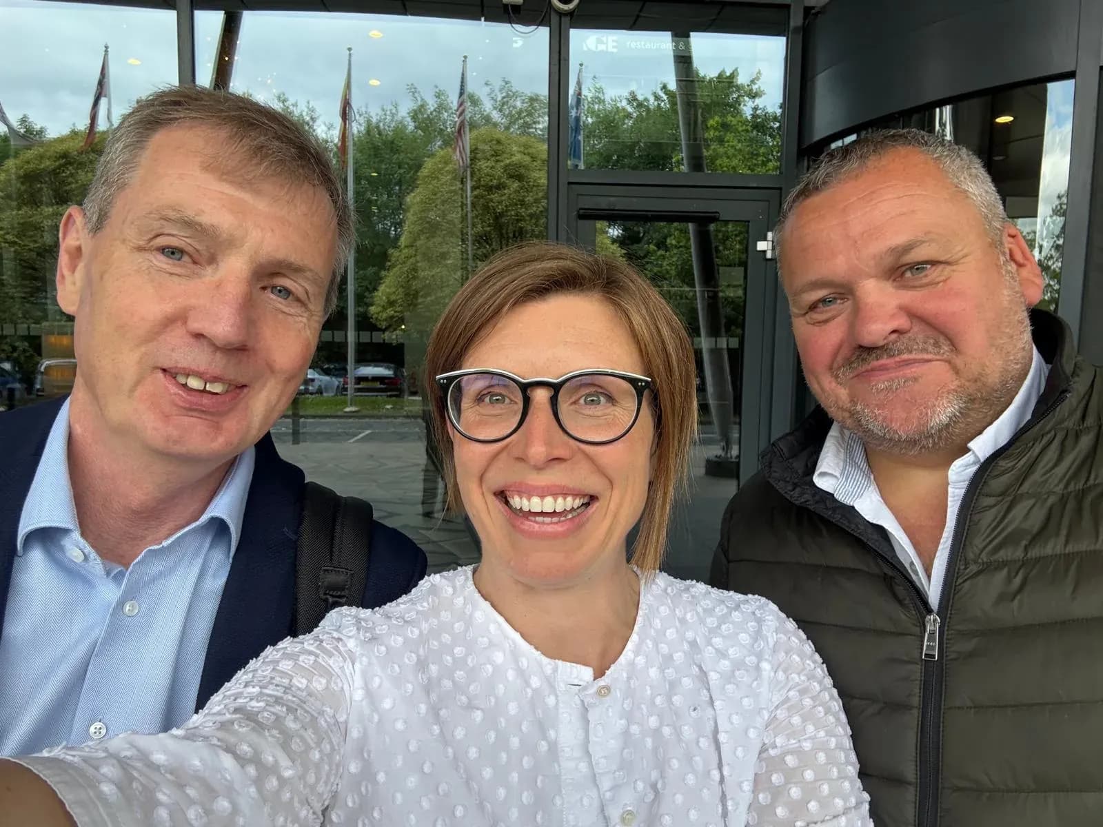Polytag's founders Phil Sutton, Alice Rackley and Brendan O'Neill outside a conference venue