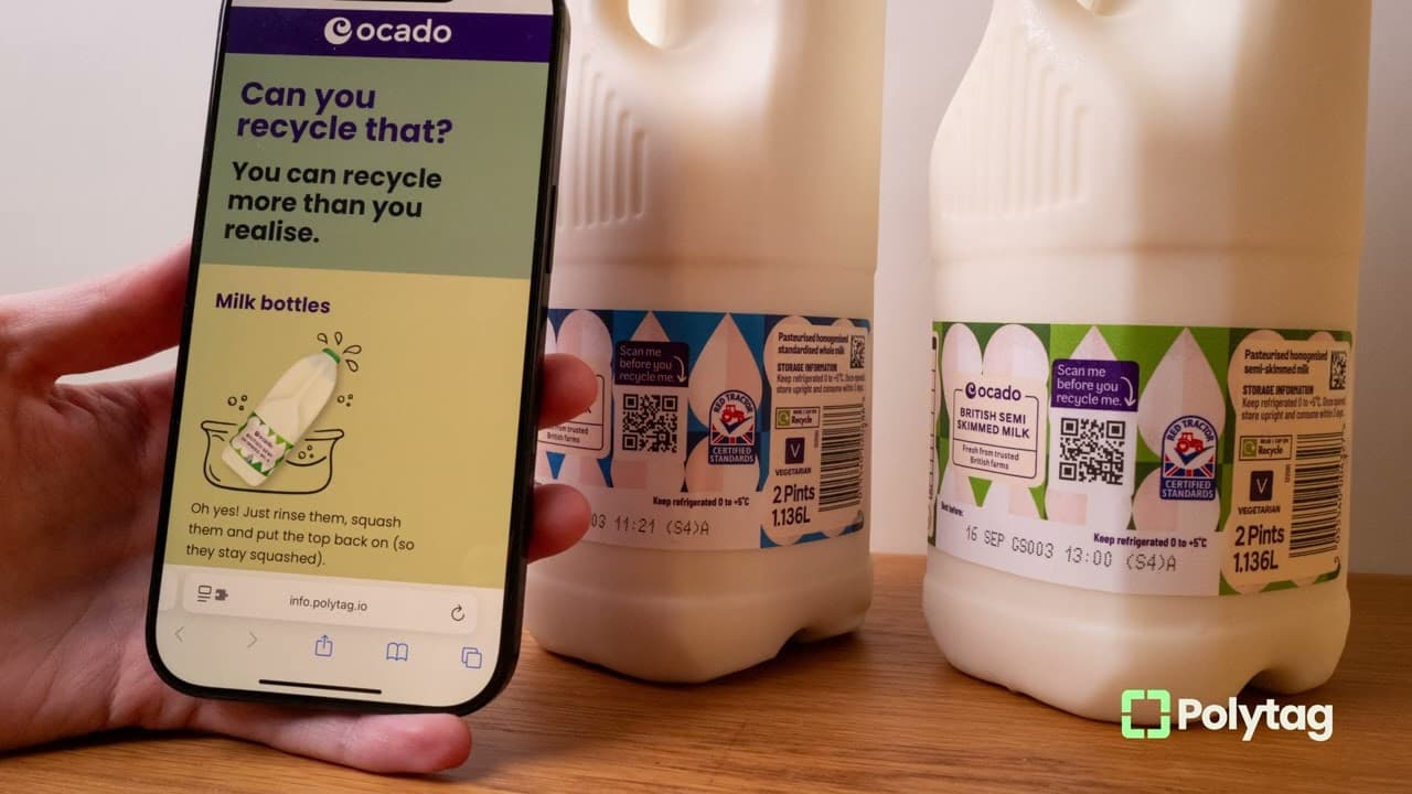 A phone showing an Ocado recycling page beside two milk bottles with Smart QR Codes